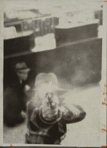 Bank Security Camera / Distributed by United Press International / Bank Robber Aiming at Security Camera, Cleveland, Ohio, March 8, 1975 / Gelatin silver print Image:67/8×413/16in / (17.4×12.2cm);Sheet:71/2×57/8in.(19.1×15cm) / The Metropolitan Museum of Art, Twentieth Century Photography Fund, 2015 (2015.278)